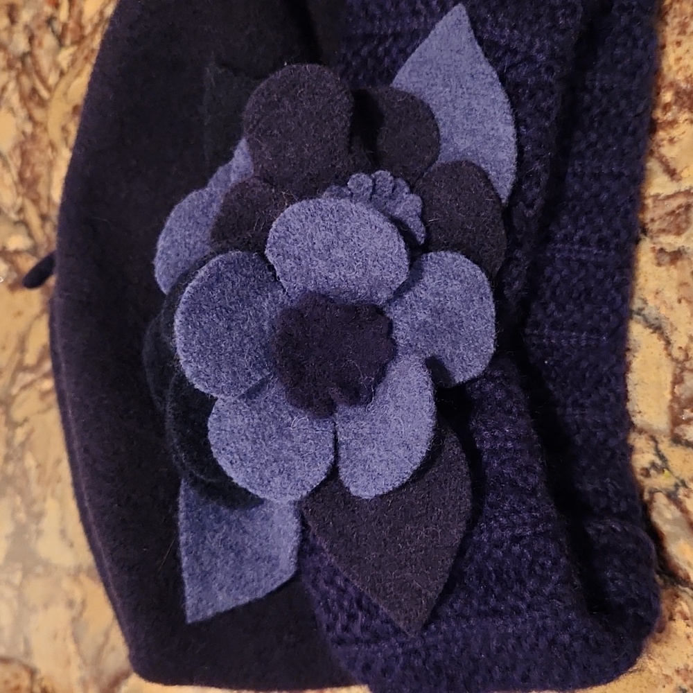 Stunning women's beret hat with floral accent.